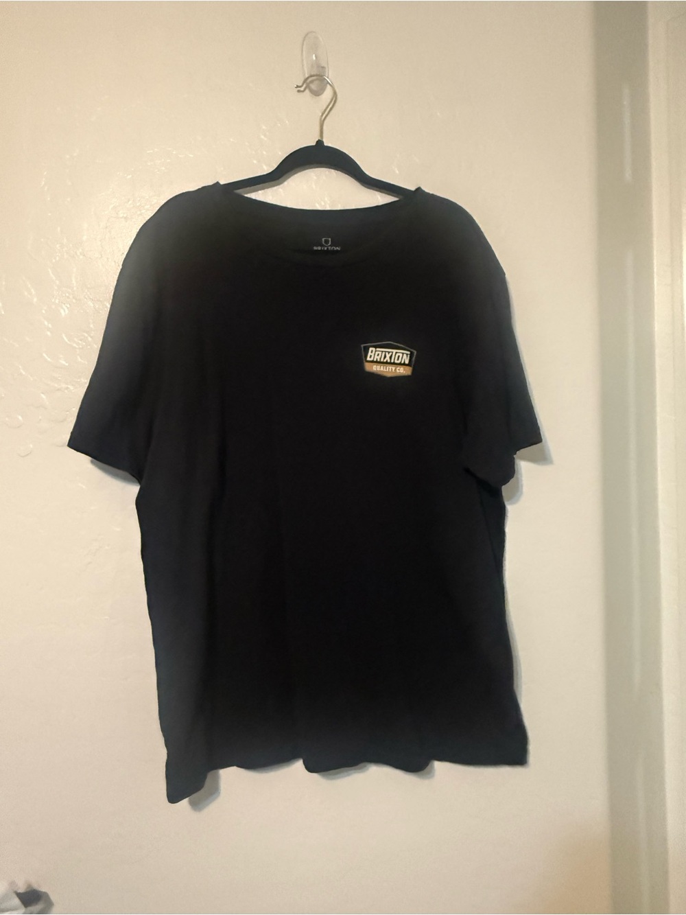 Brixton Black Tee with Small Gold Chest Patch
